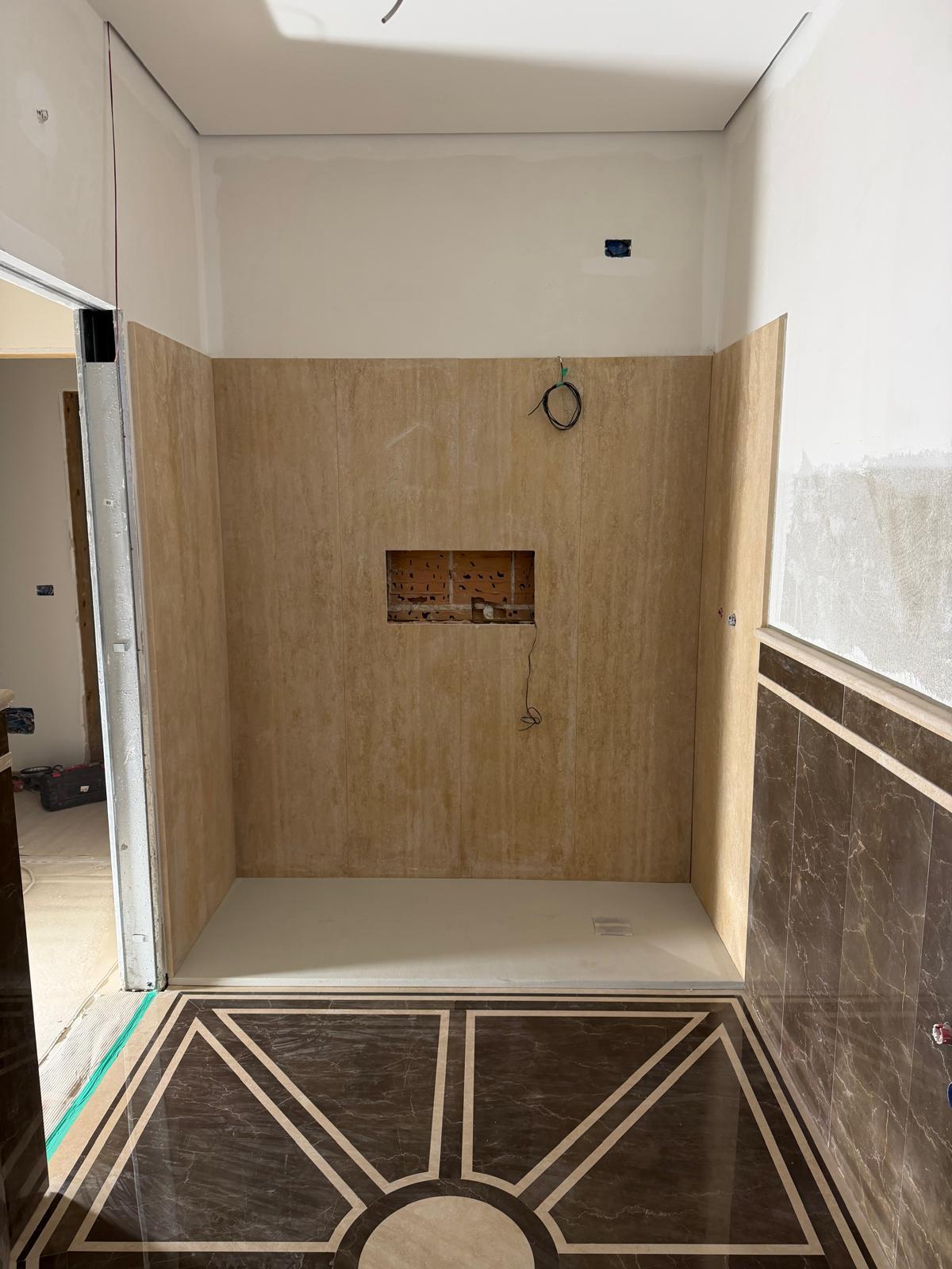 Shower clad in Roman Travertine