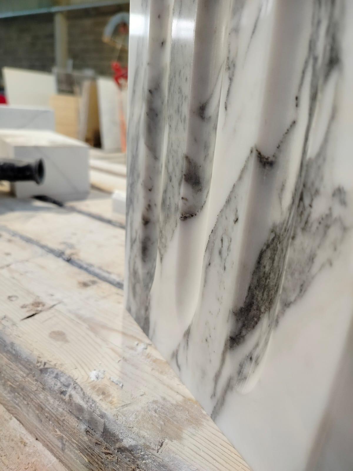 Detail of fluted Arabescato marble moulding