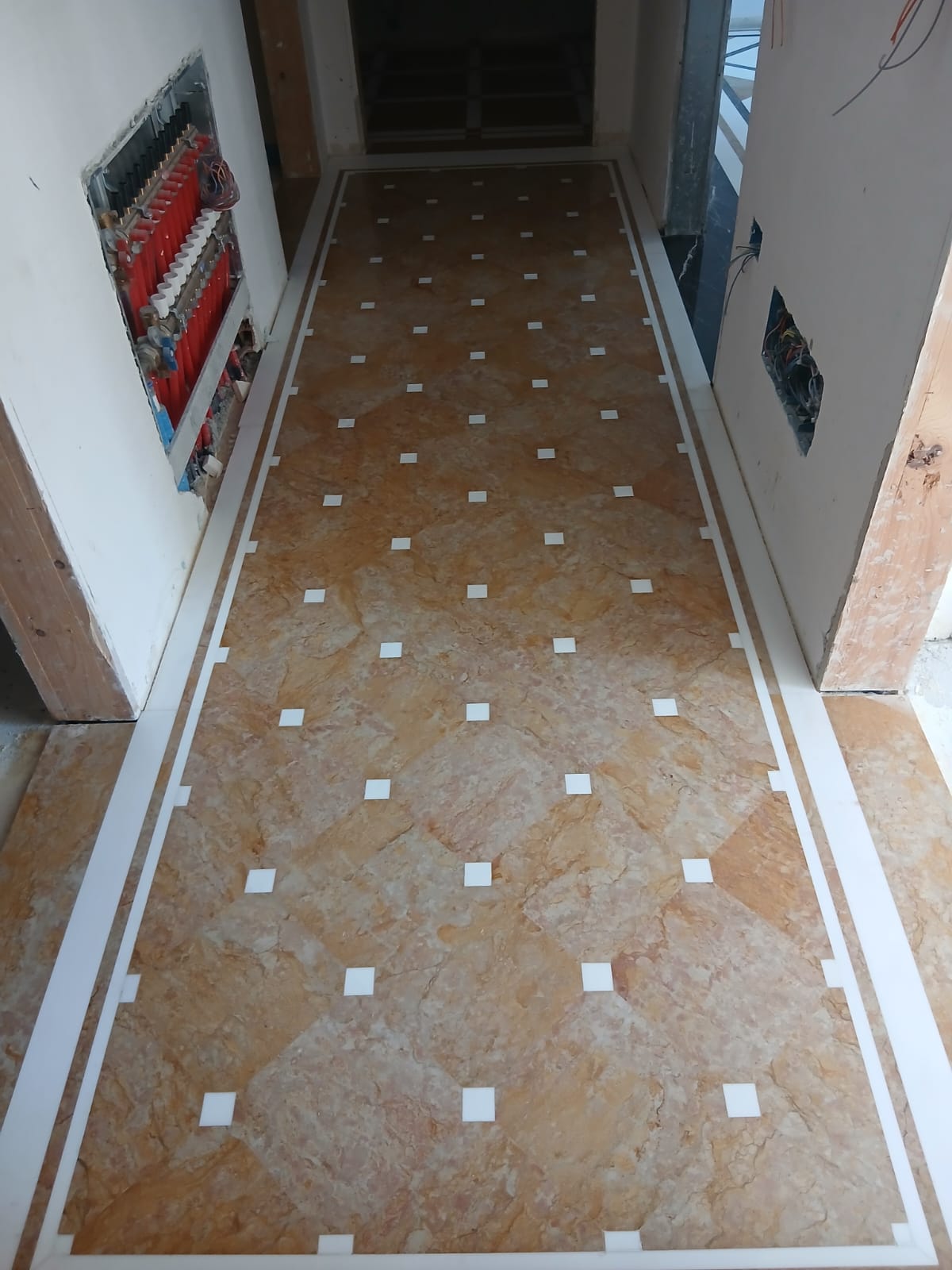 Rosa Portogallo marble corridor with white inserts